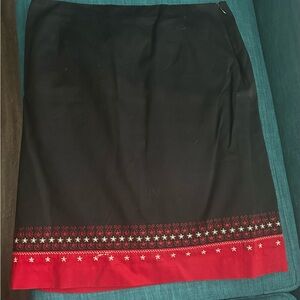 Black skirt with trim.